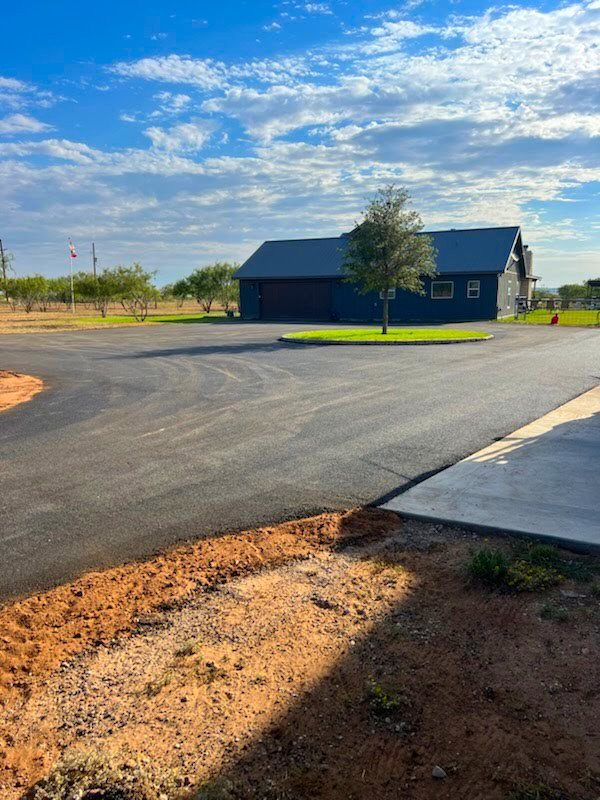 New asphalt circle drive with a concrete apron, August 2024